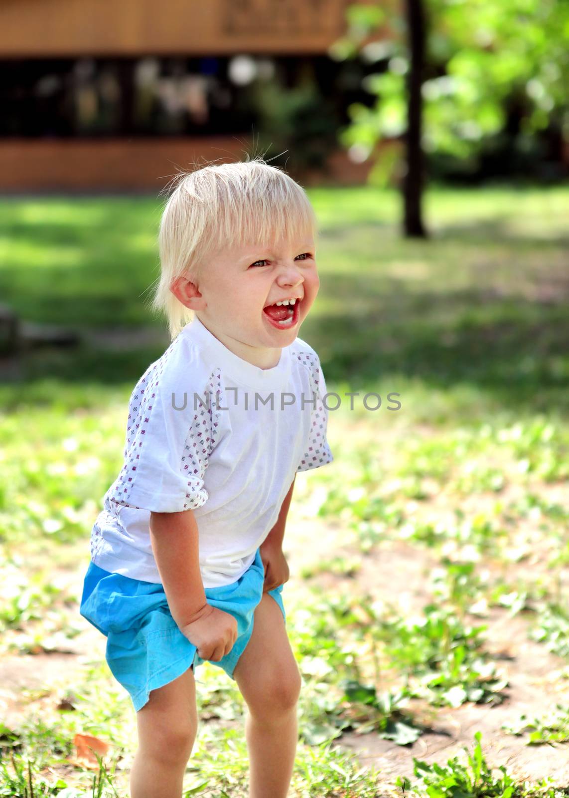 Cheerful Child Laugh at the Summer Park