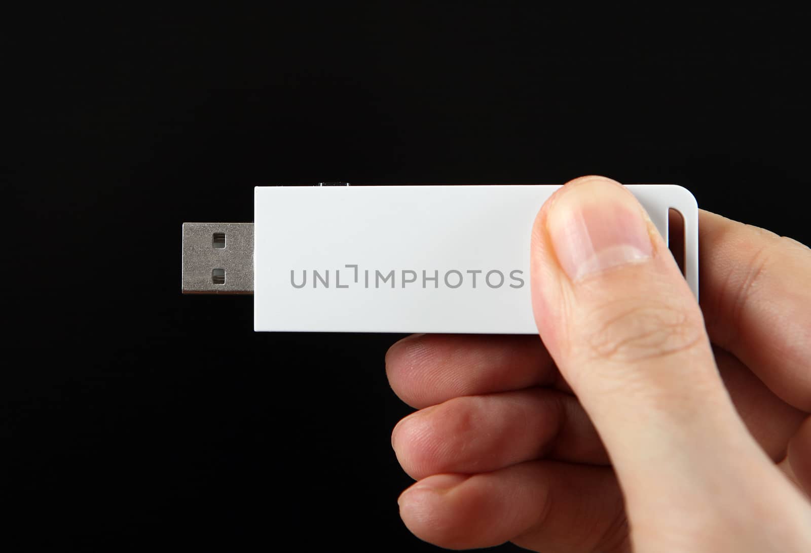 USB Drive in the Hand by sabphoto