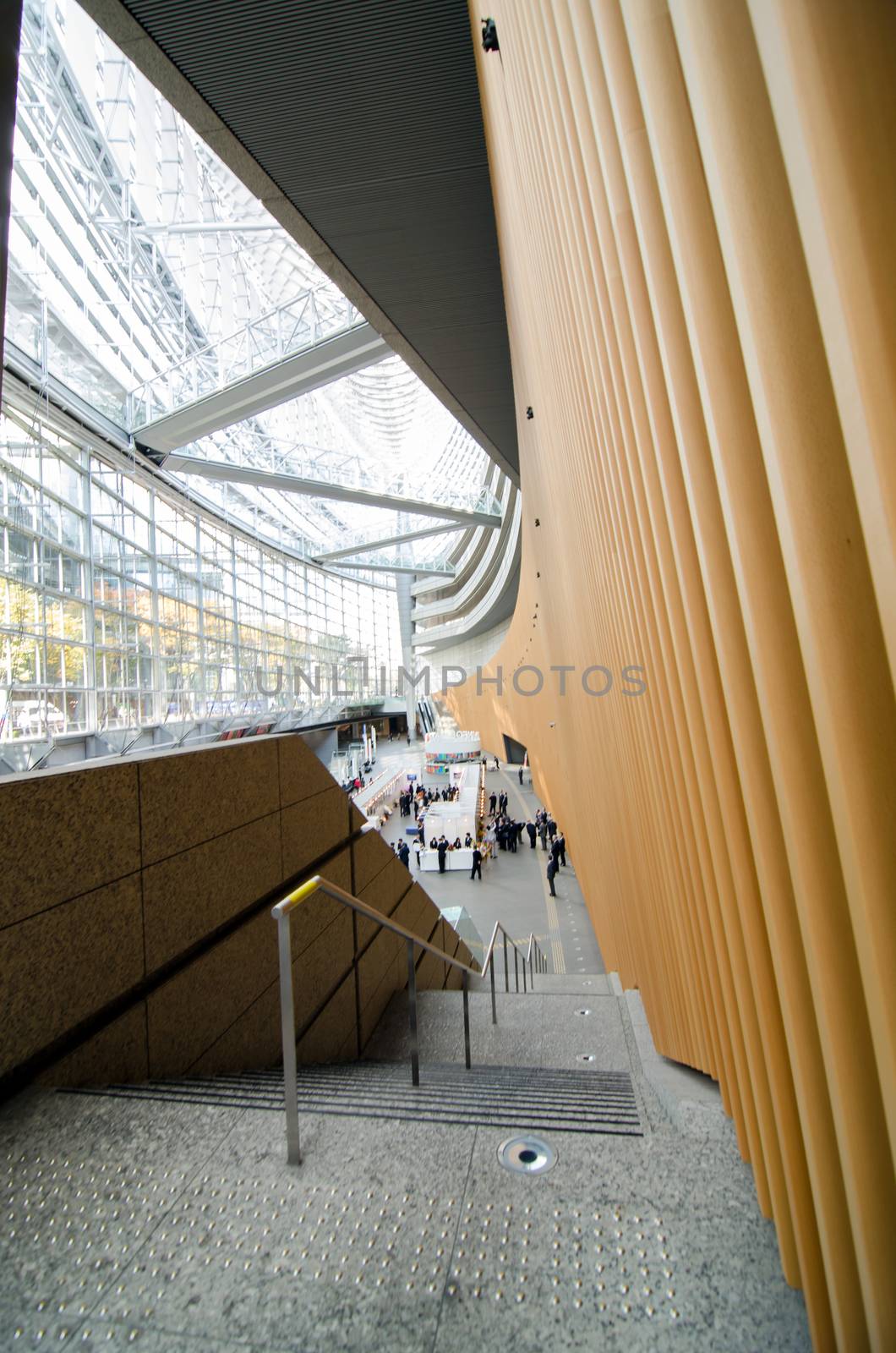 Tokyo, Japan - November 26, 2013: People visit Tokyo International Forum on November 26 2013 in Tokyo Japan. the Forum is one of Tokyo's architectural marvels. Architect Rafael Vinoly won Japan's first international architecture competition with his design.