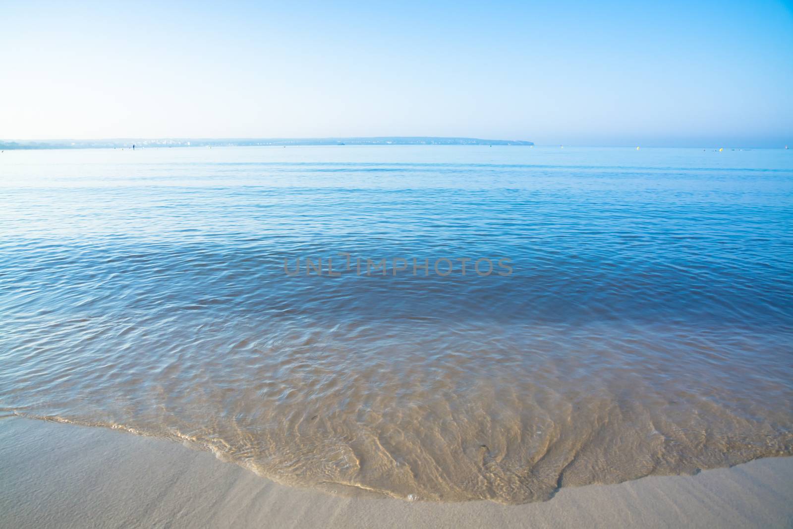 Morning waves closeup. Mallorca, Balearic islands, Spain in July.