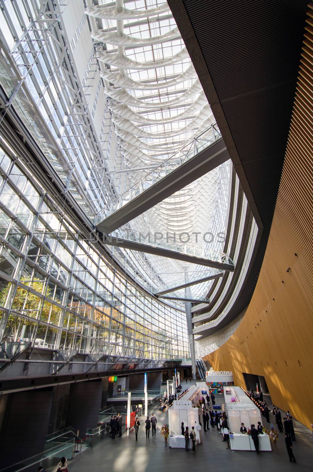 Tokyo, Japan - November 26, 2013: People visit Tokyo International Forum on November 26 2013 in Tokyo Japan. the Forum is one of Tokyo's architectural marvels. Architect Rafael Vinoly won Japan's first international architecture competition with his design.