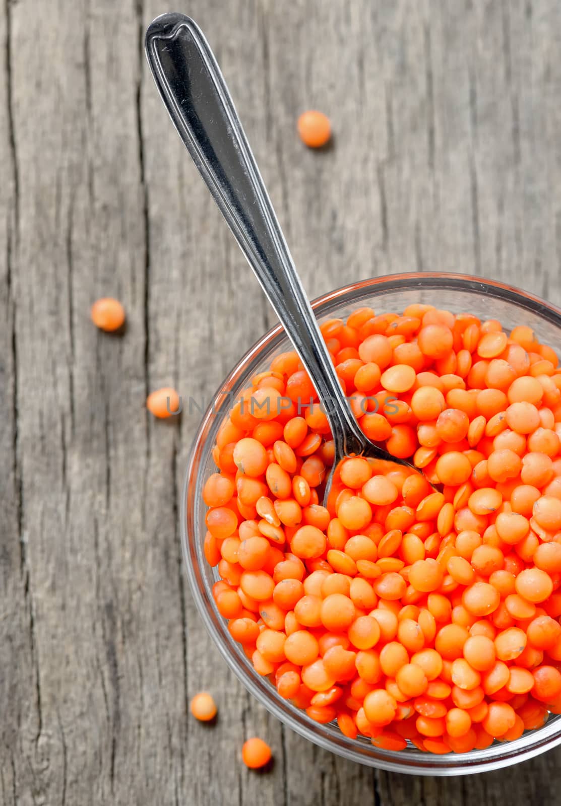 red lentils isolated on old wood table