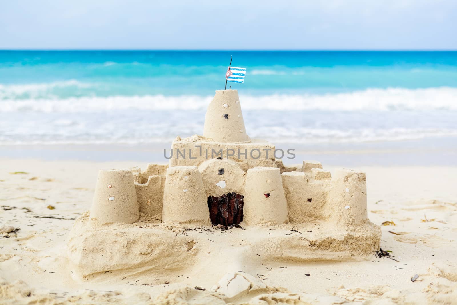 Cuban Sandcastle with the country Flag on one of the most Beautiful Beach of Cuba
