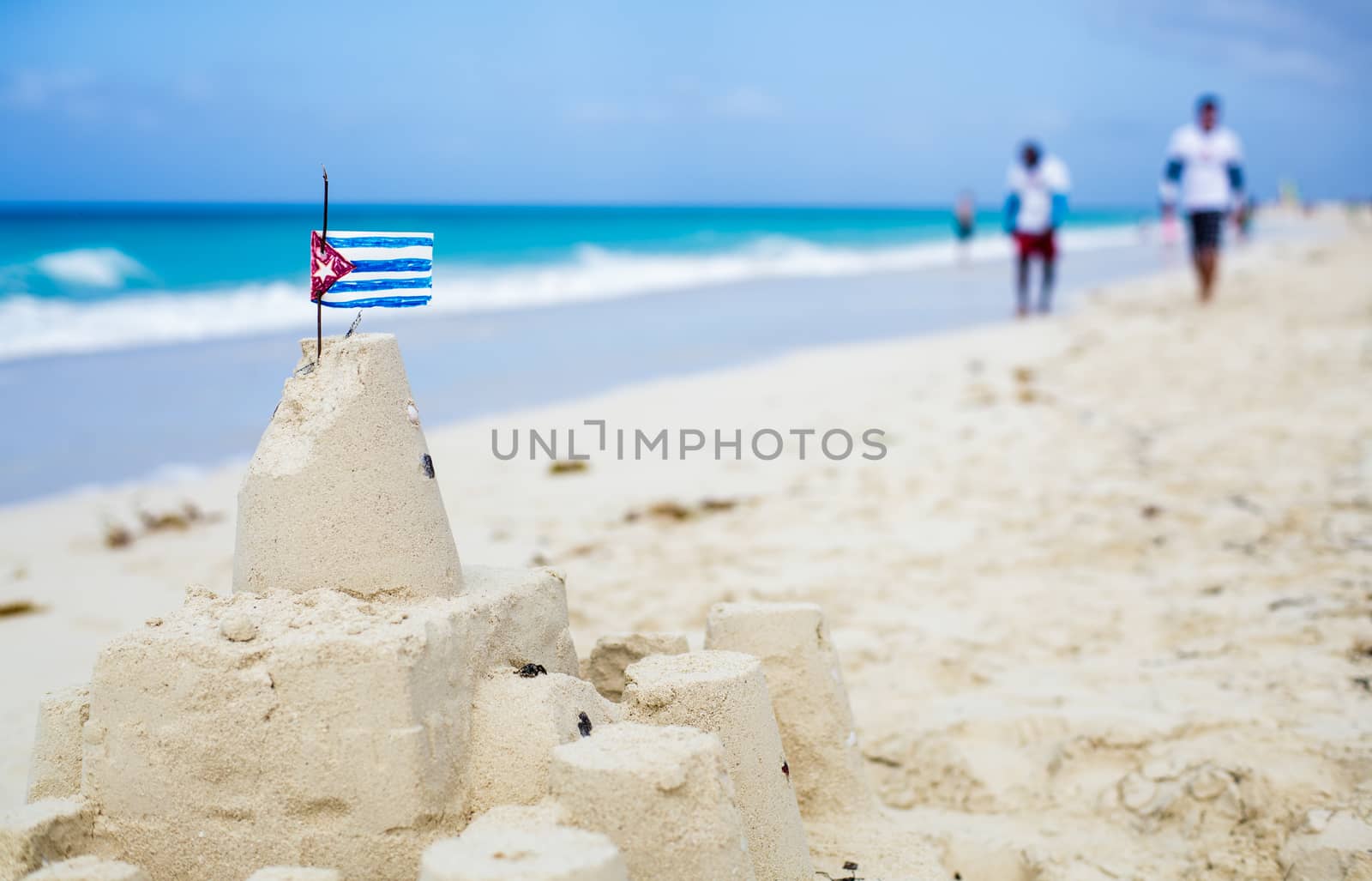 Cuban Sandcastle with the country Flag in Cuba. by aetb