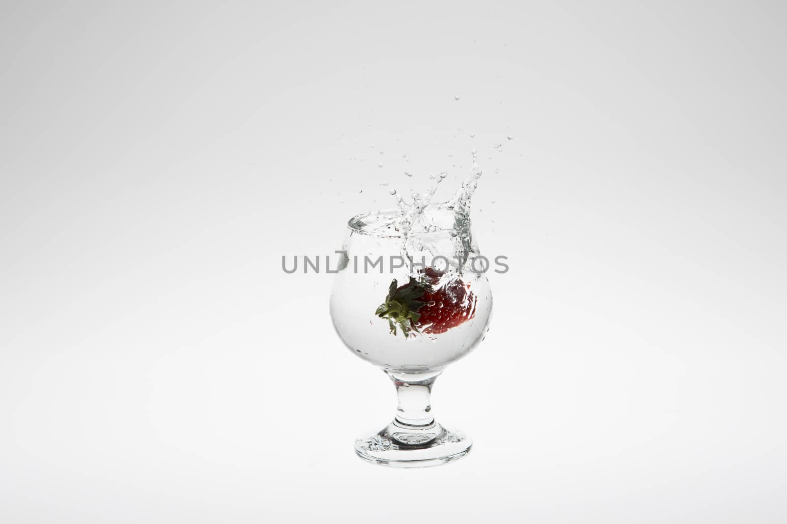 strawberry in the water splash on white background