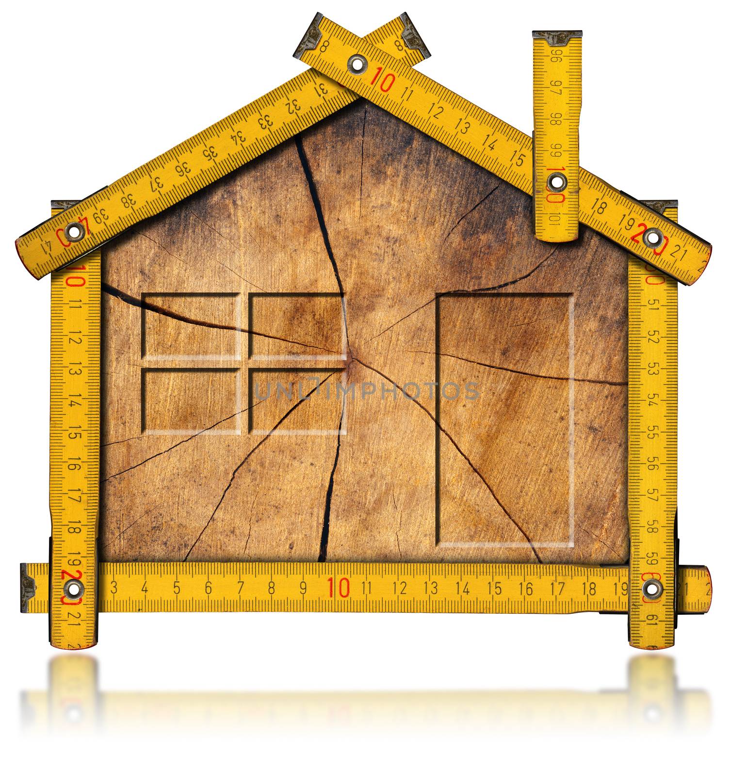 Wooden house project concept. Wooden meter ruler in the shape of house with section of tree trunk inside. Isolated on white background
