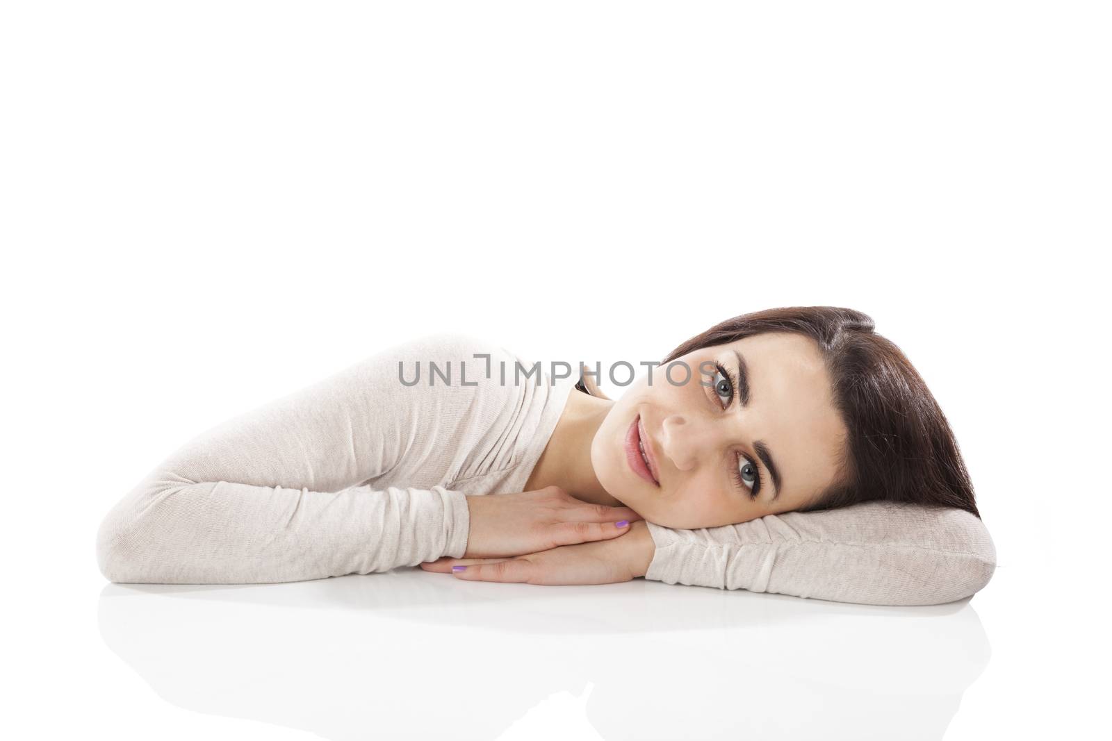 Happy beautiful sexy brunette looking into camera isolated on white background with copy space.