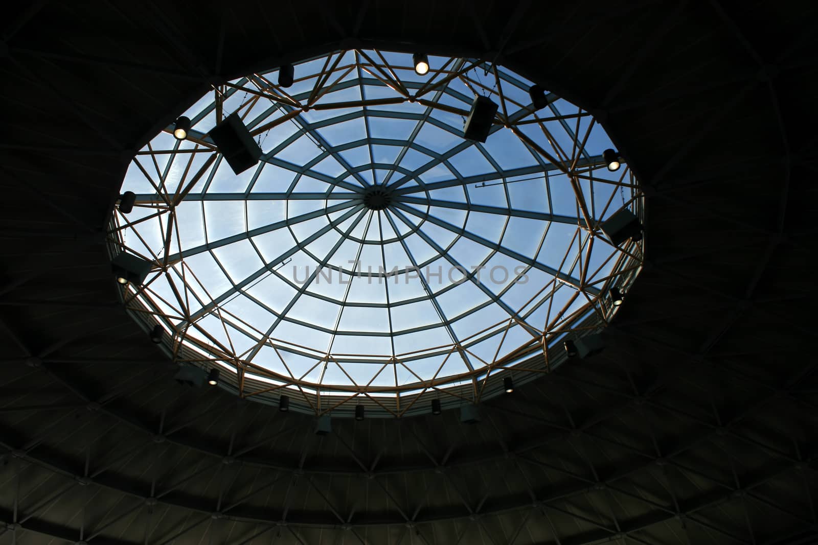 A large window in a roof with a geometric pattern