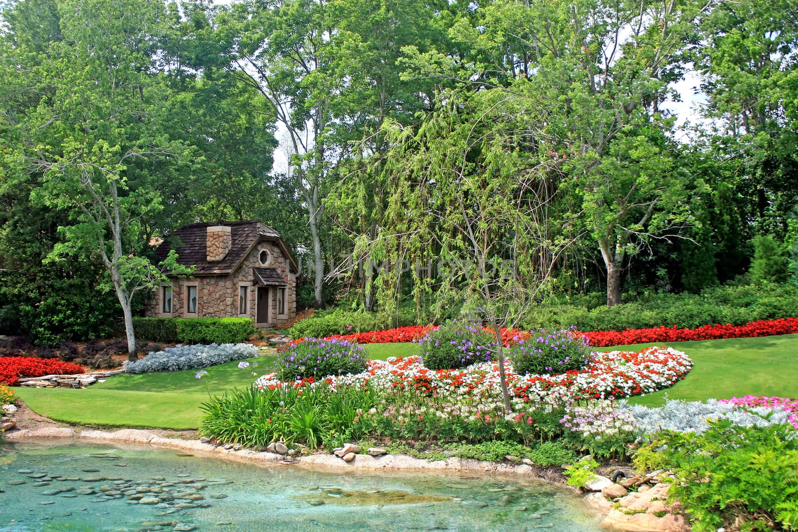 A beautiful garden with a little house