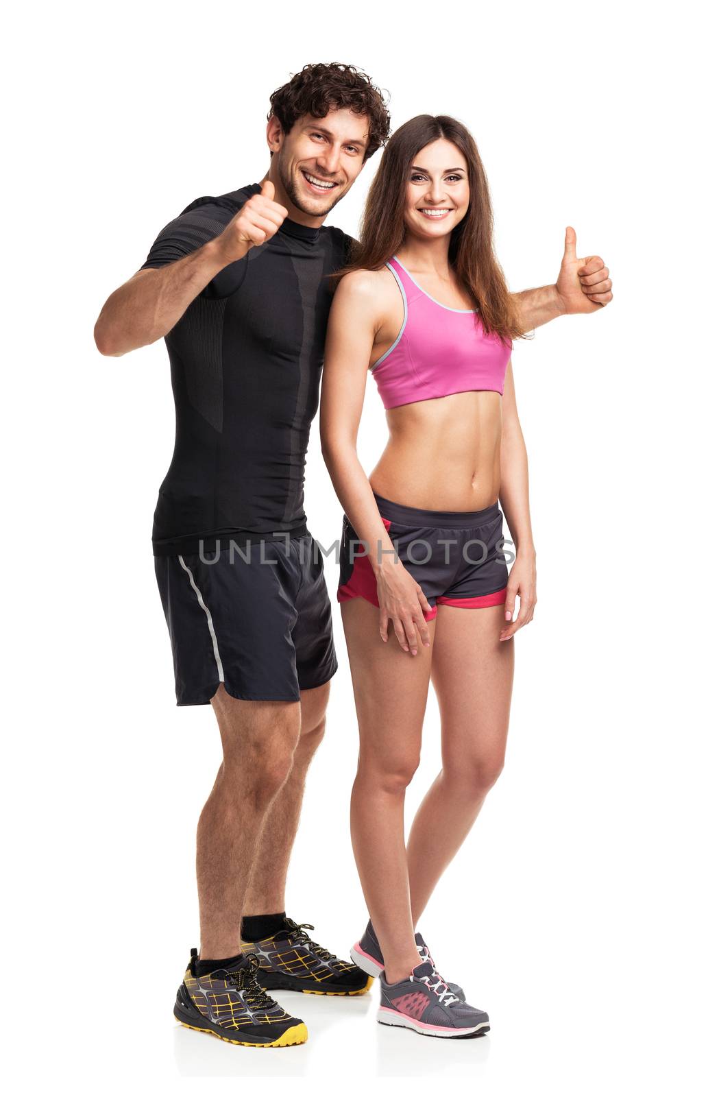 Sport couple - man and woman after fitness exercise on the white background