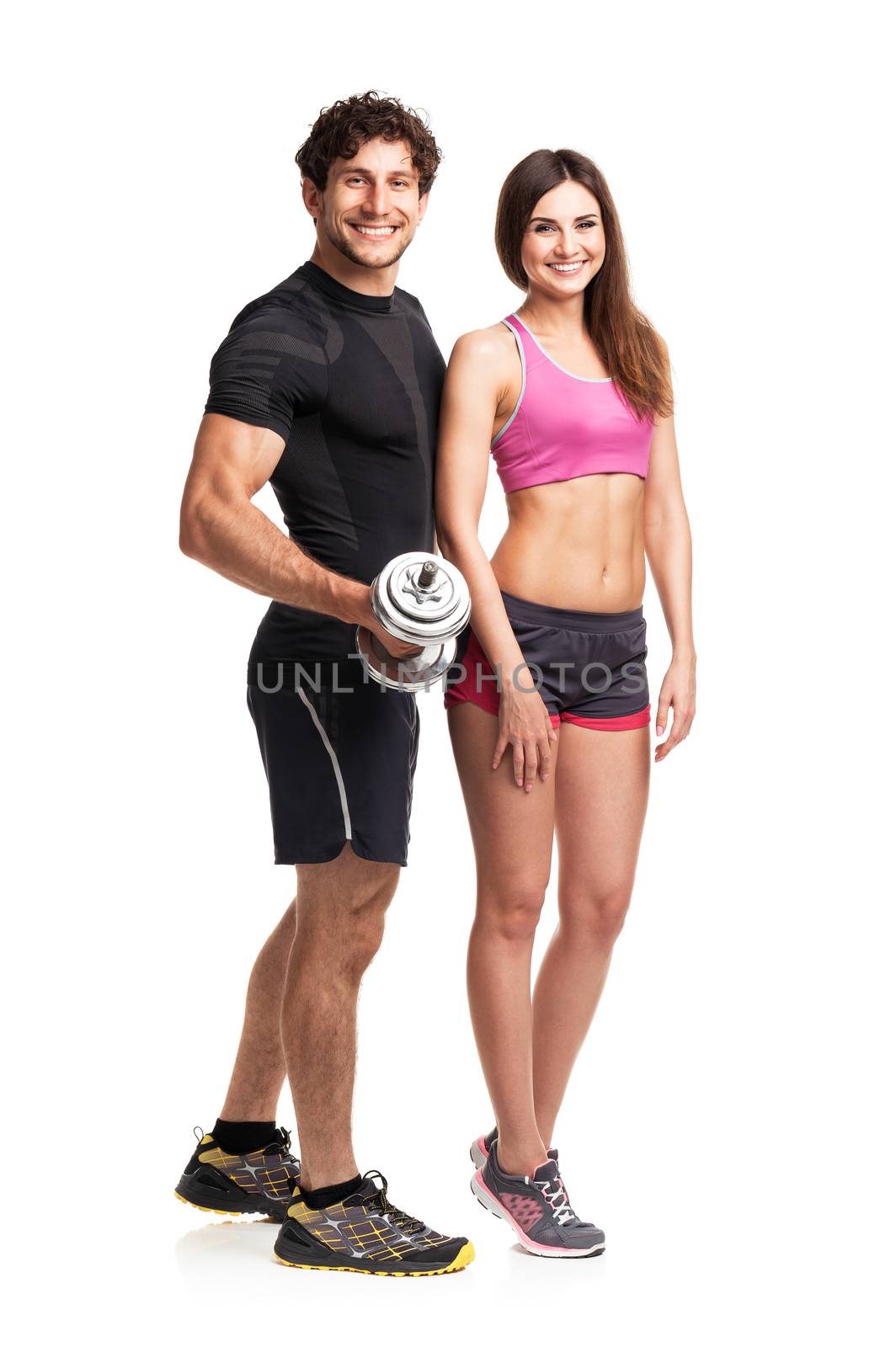 Sport couple - man and woman with dumbbells on the white background