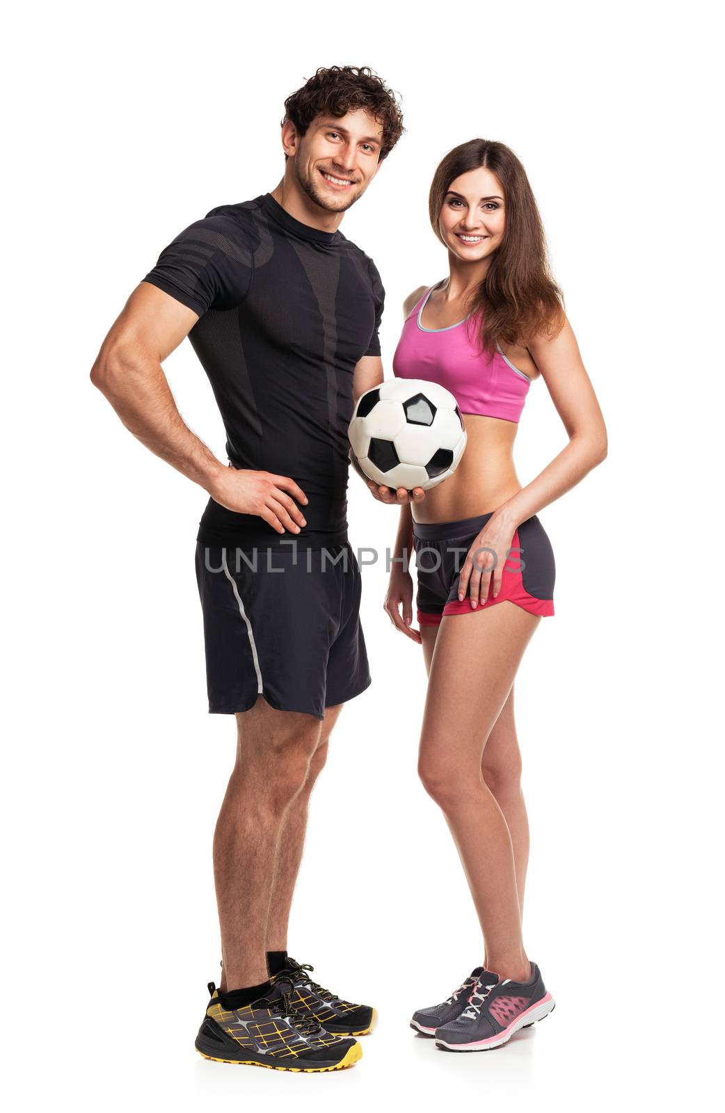 Athletic man and woman with ball on the white by vlad_star