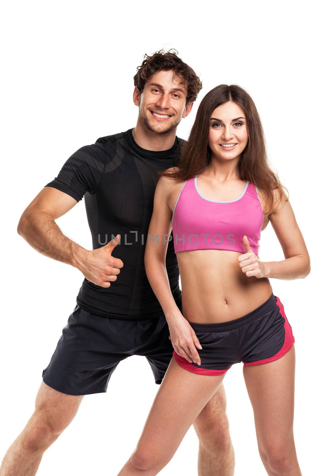 Athletic couple - man and woman with thumb up on the white by vlad_star