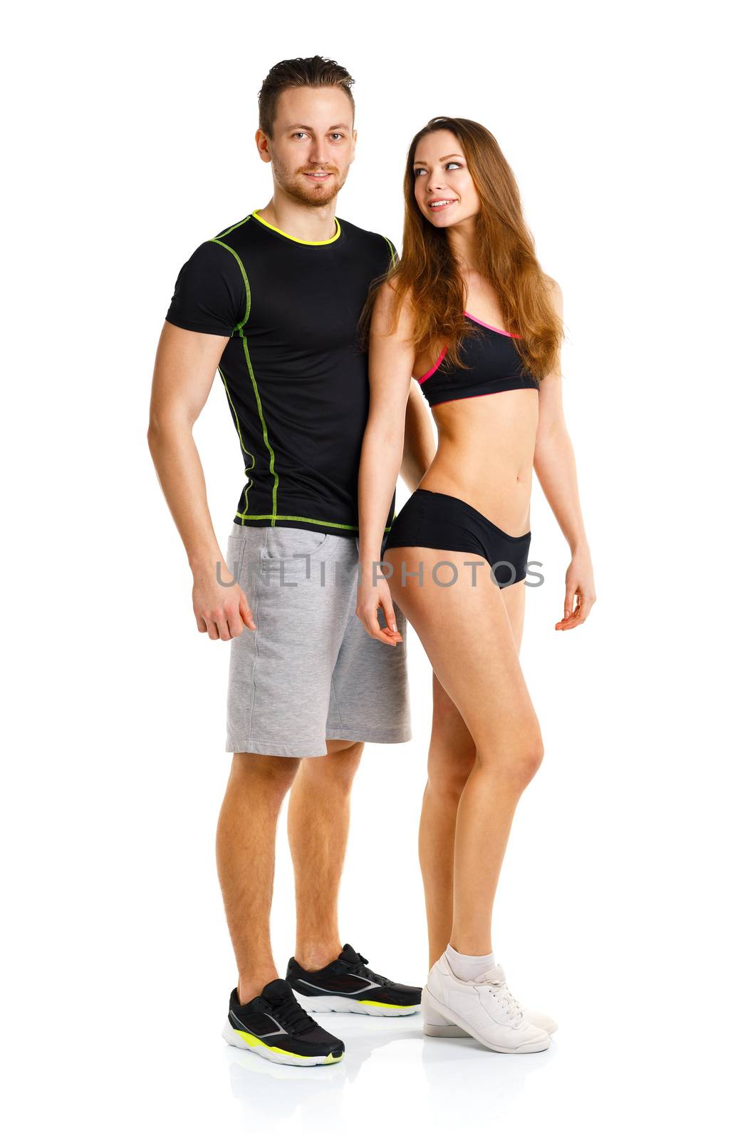 Sport couple - man and woman after fitness exercise on the white background