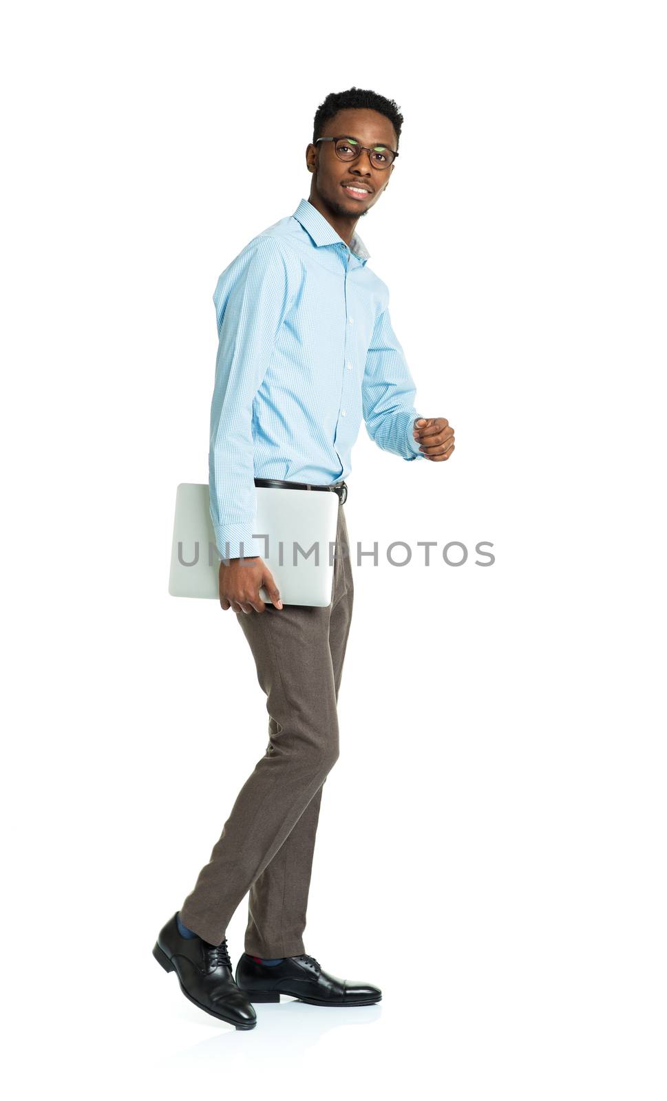 Happy african american college student with laptop standing on white background