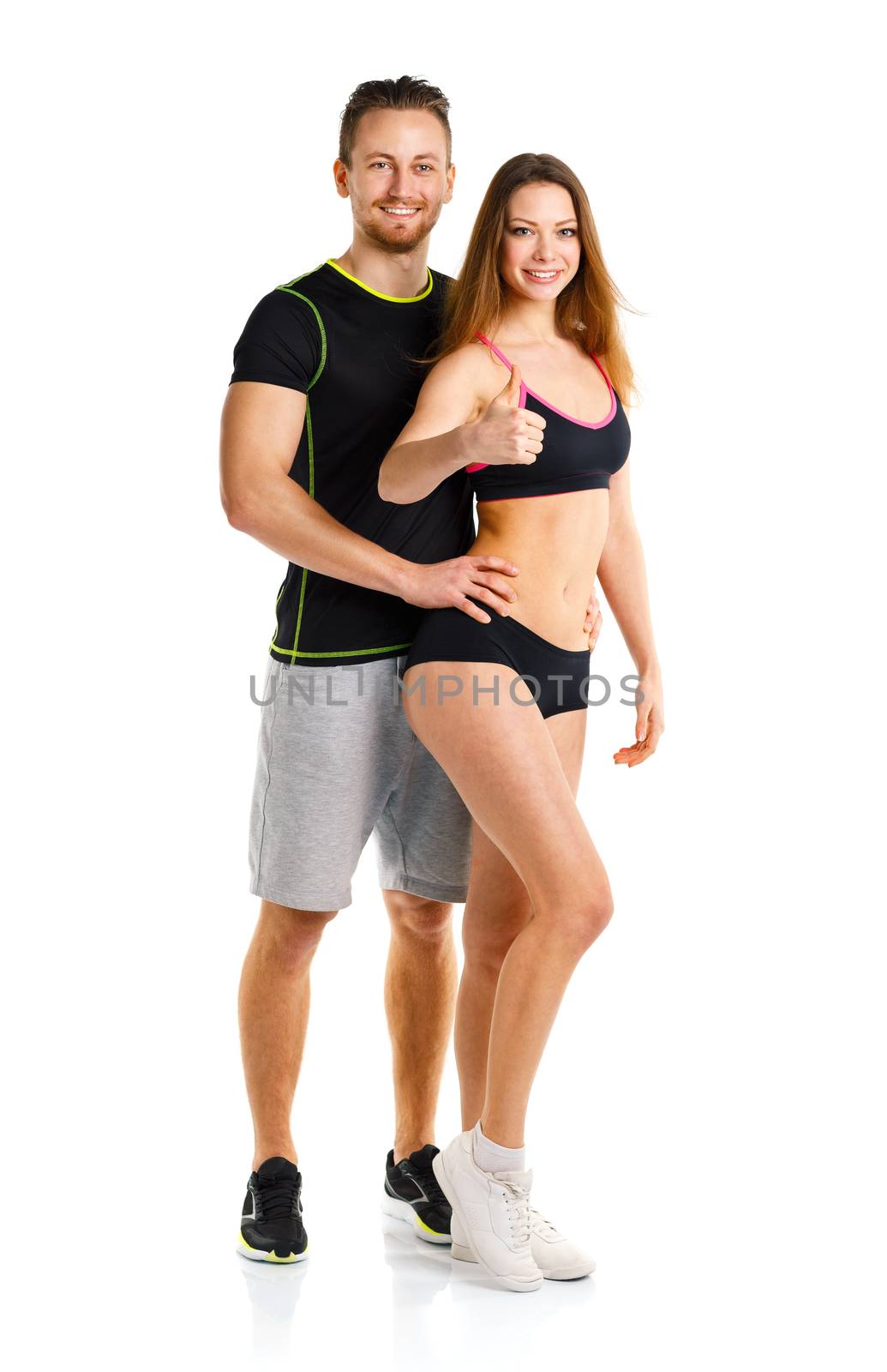 Athletic man and woman after fitness exercise with a finger up on the white background