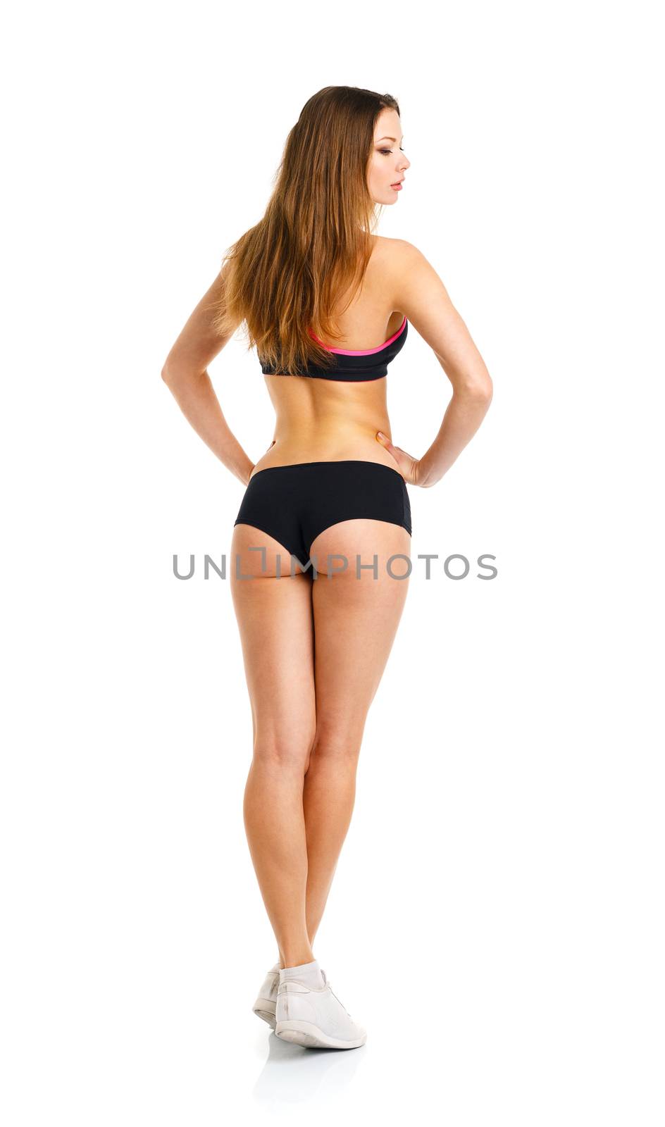 Young athletic girl on white background, view from the back