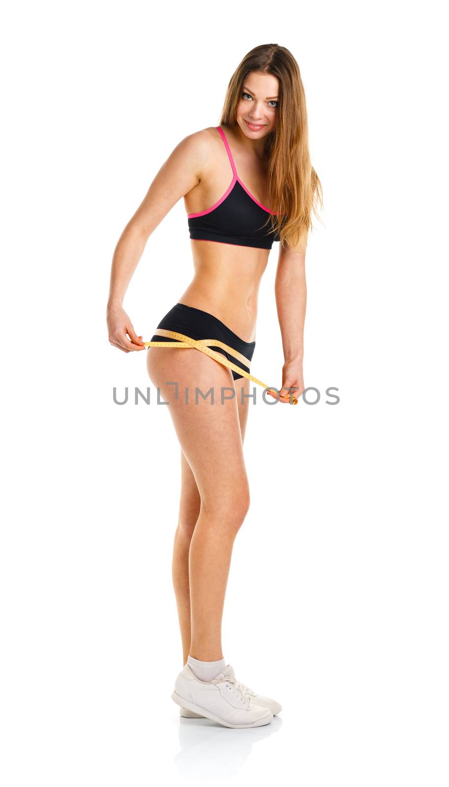 Athletic woman measuring perfect shape of beautiful thigh, healthy lifestyles concept