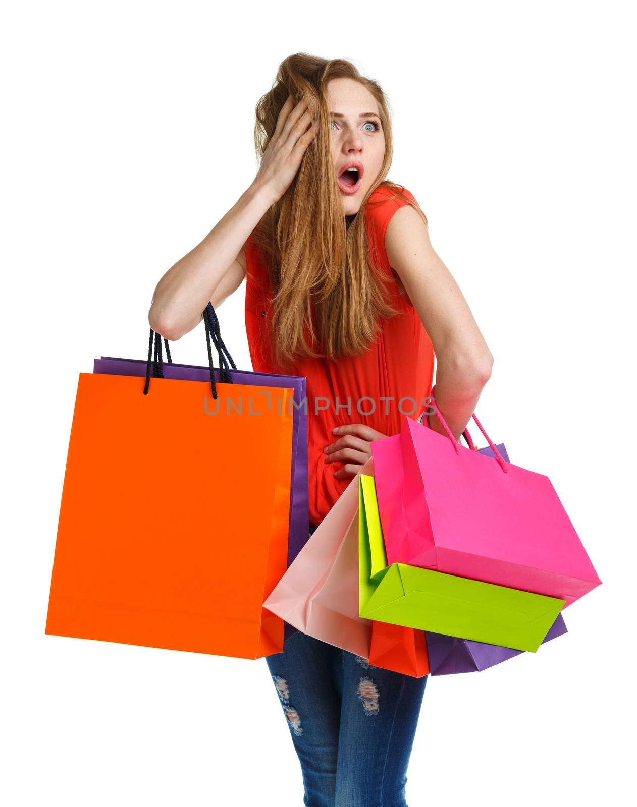 Young caucasian woman holding shopping bags on white background  by vlad_star