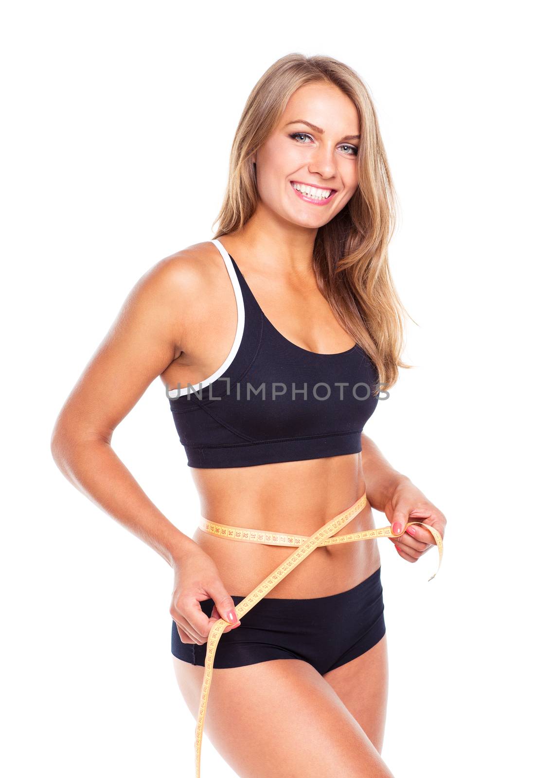 Portrait of attractive caucasian smiling woman with measuring tape isolated on white background