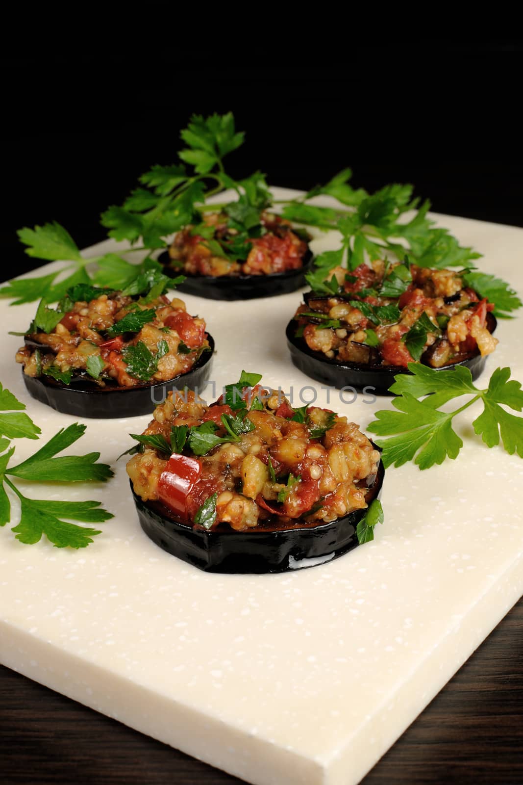 Appetizer of fried eggplant stuffed with vegetables, herbs