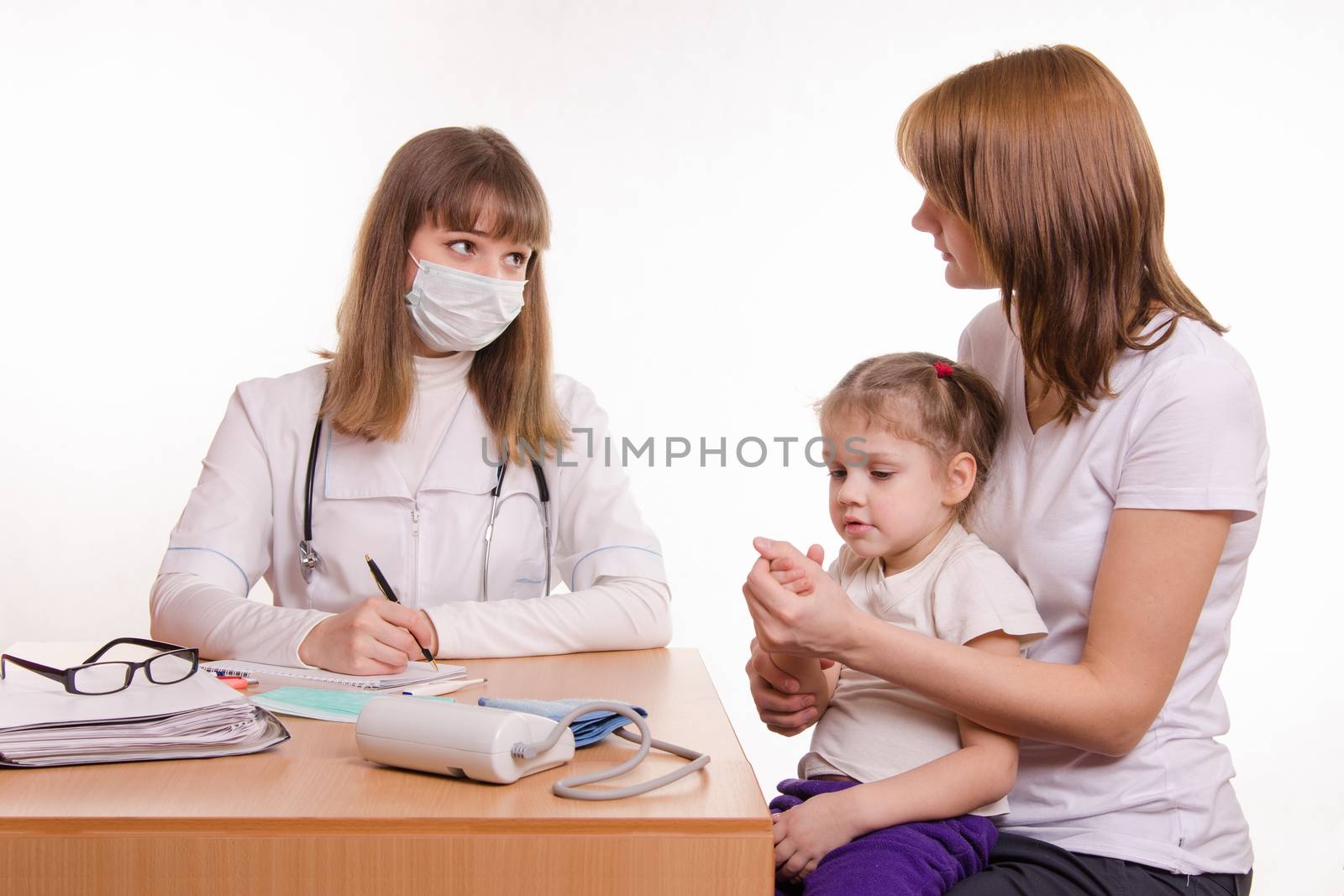 Woman with a small child on reception at the pediatrician