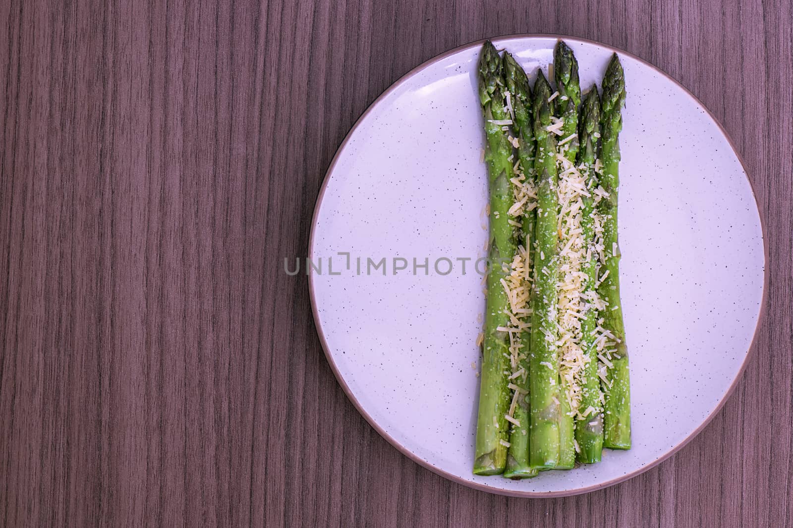 Delicious fresh roasted asparagus whit parmesan cheese