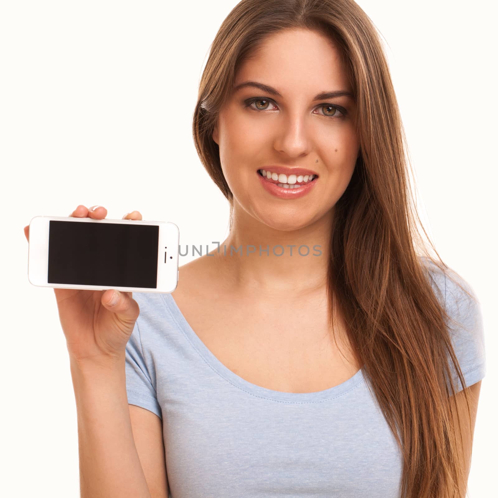 Young caucasian woman with smartphone over white background