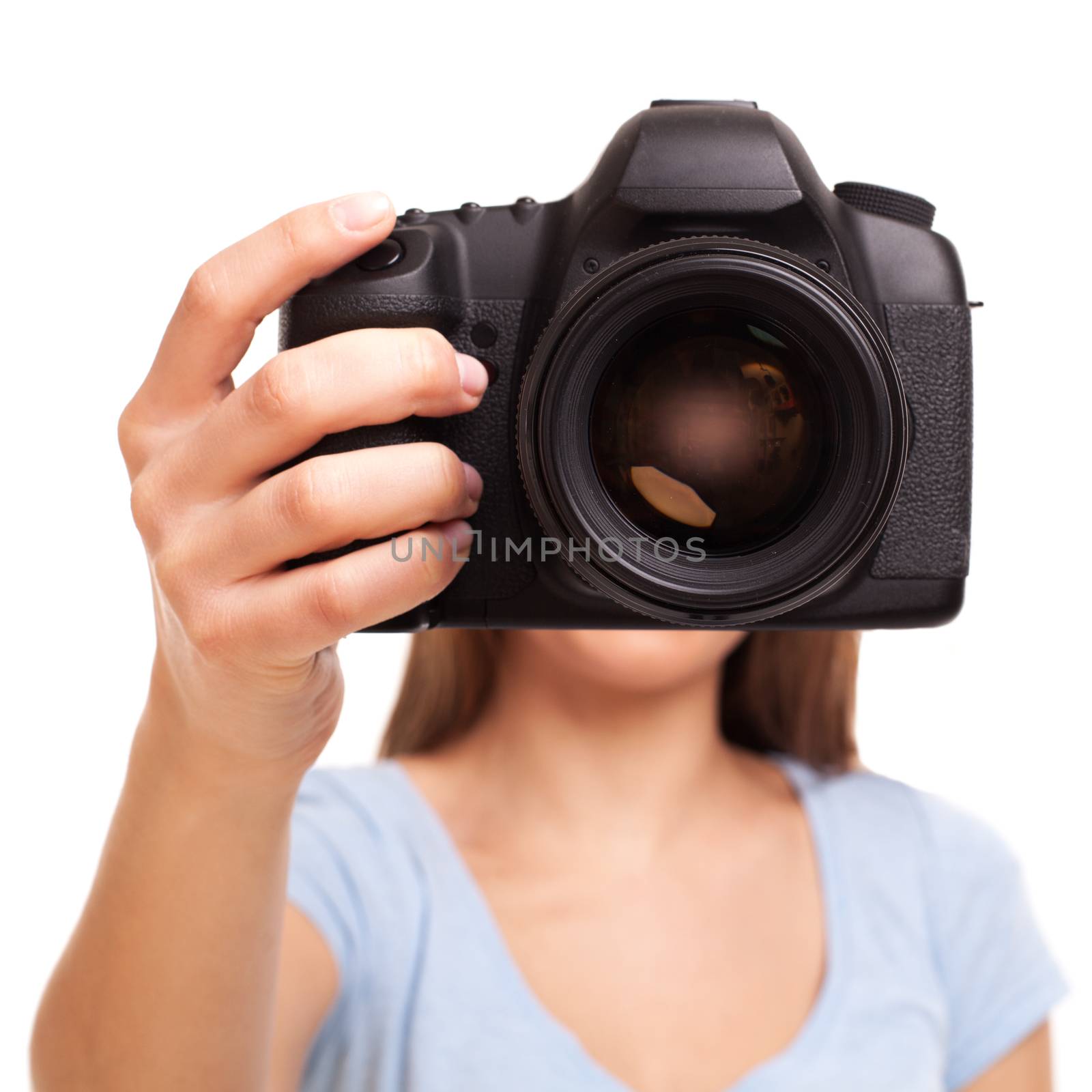 Young caucasian woman with professional camera in her hand
