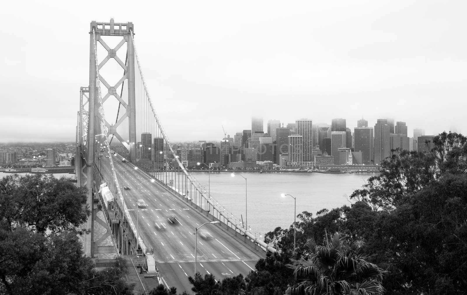 The fog hangs low over San Francisco and the Bay Bridge