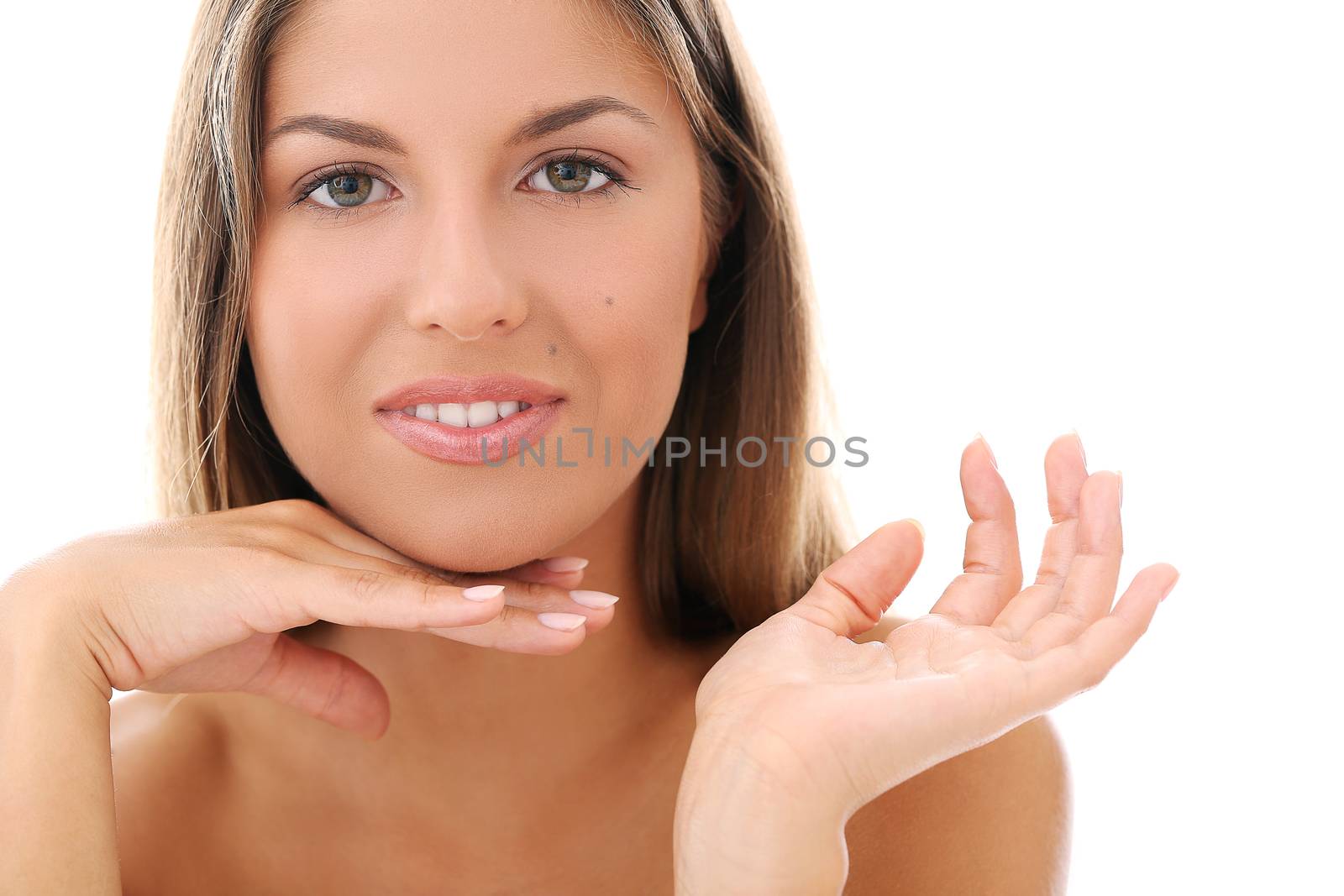 Portrait of a beautiful woman who is holding her hands hear her face