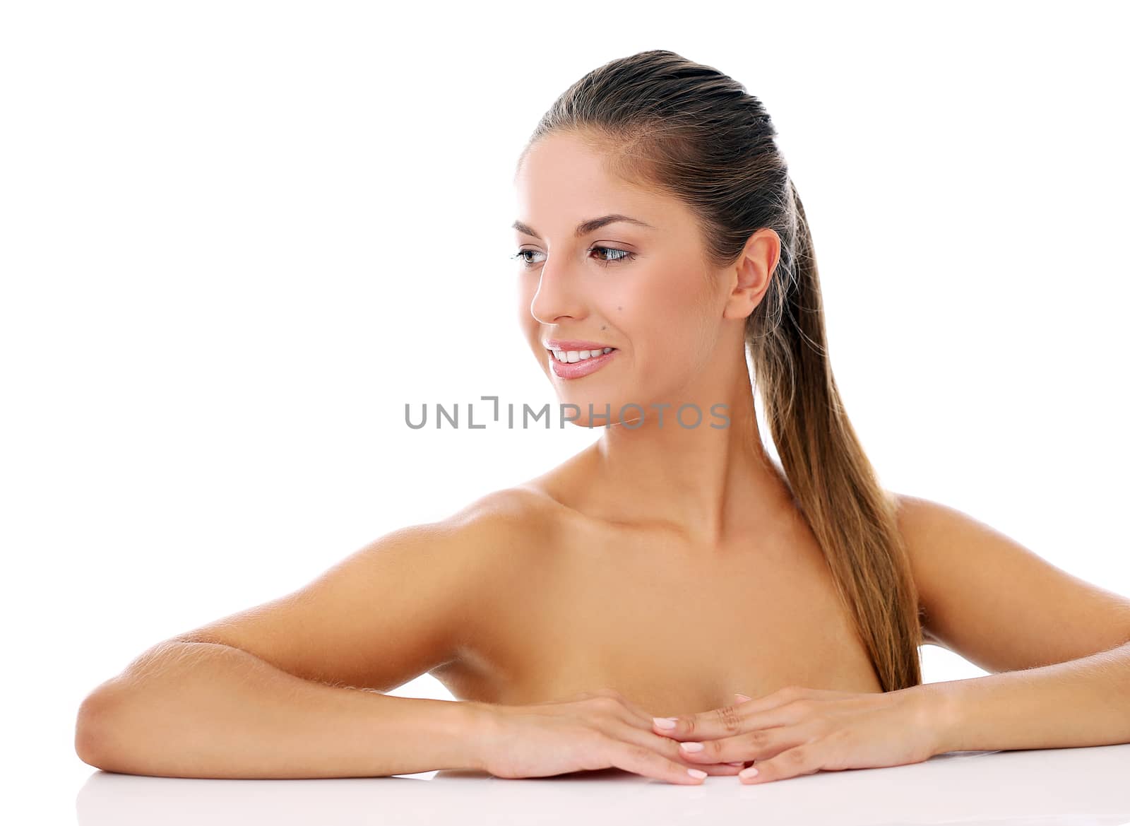 Portrait of a beautiful woman who is posing happily and tenderly over a white background