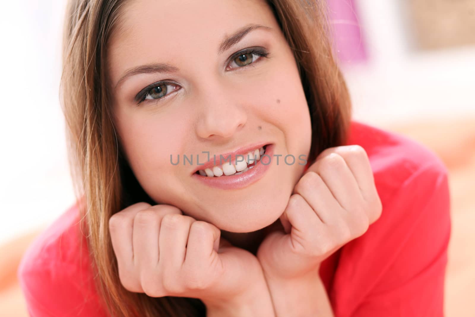 Portrait of happy young woman with long hair