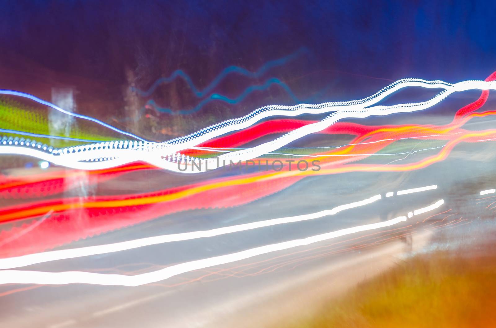 Long exposure of a vehicle traveling at night.