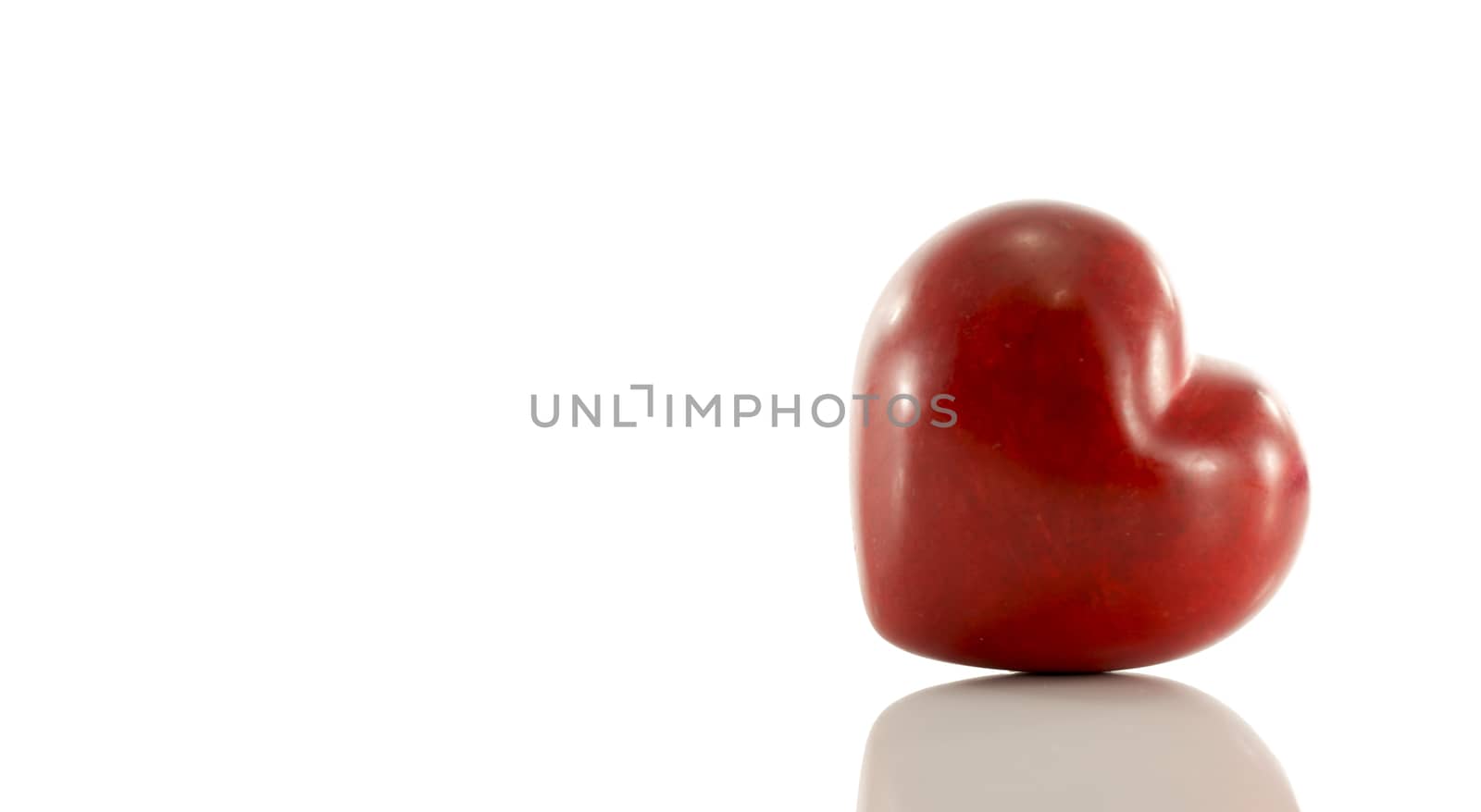 red marble heart isolated on white