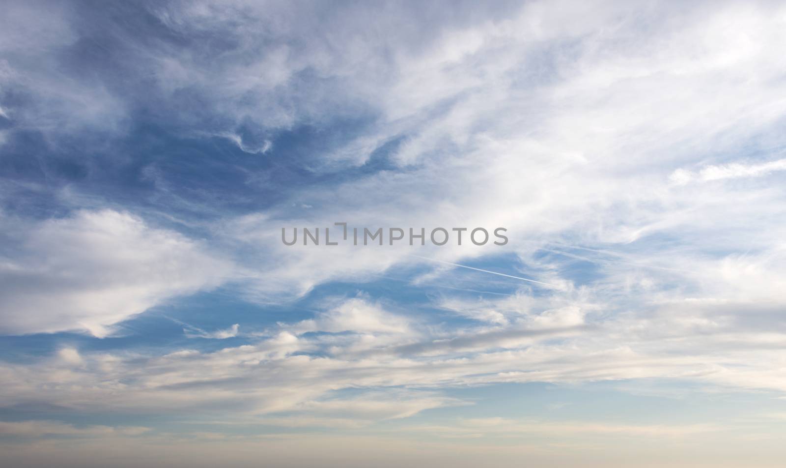 white clouds stripes and blue sky by compuinfoto