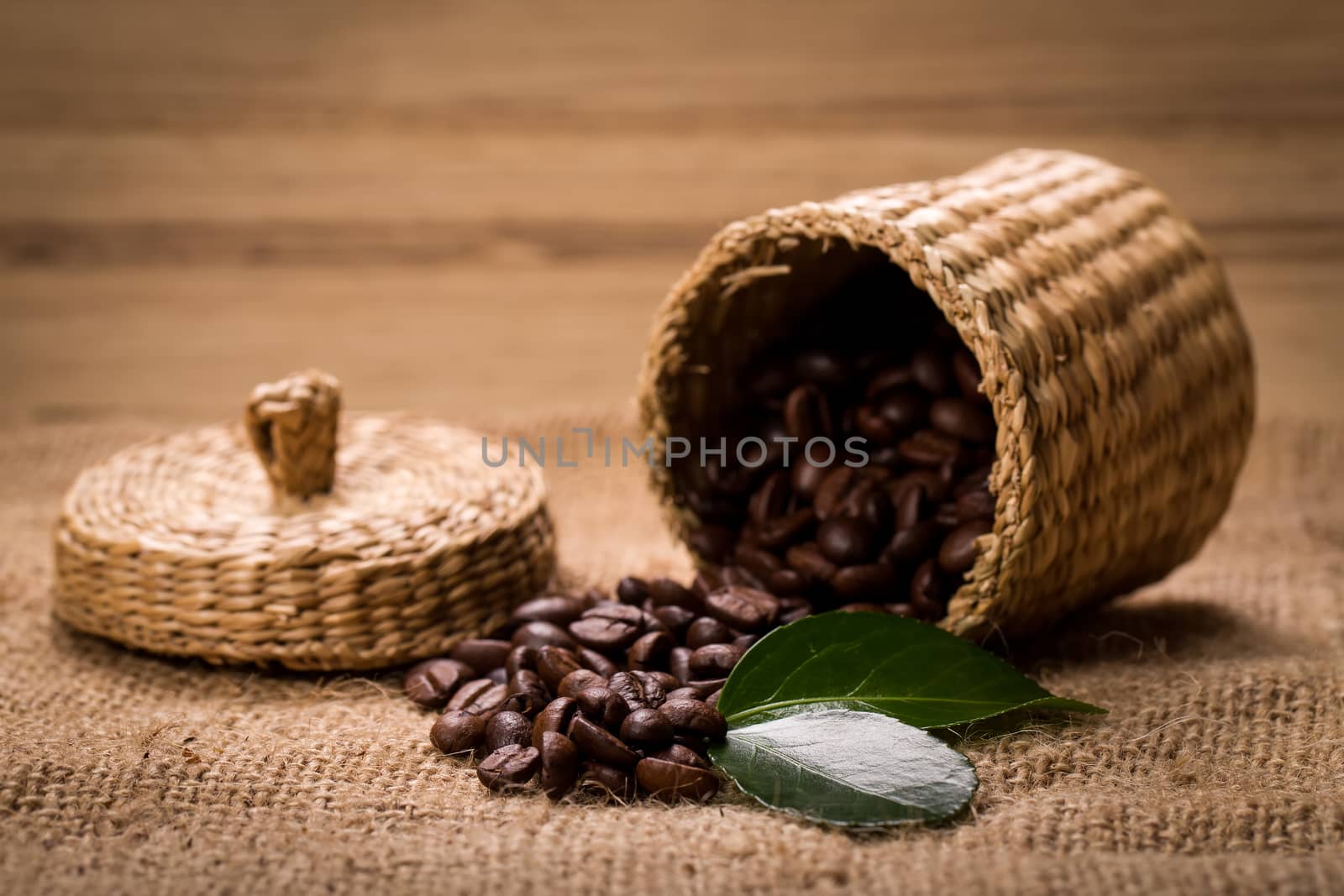 pile of coffee beans and wooden spoon in jar with space for text