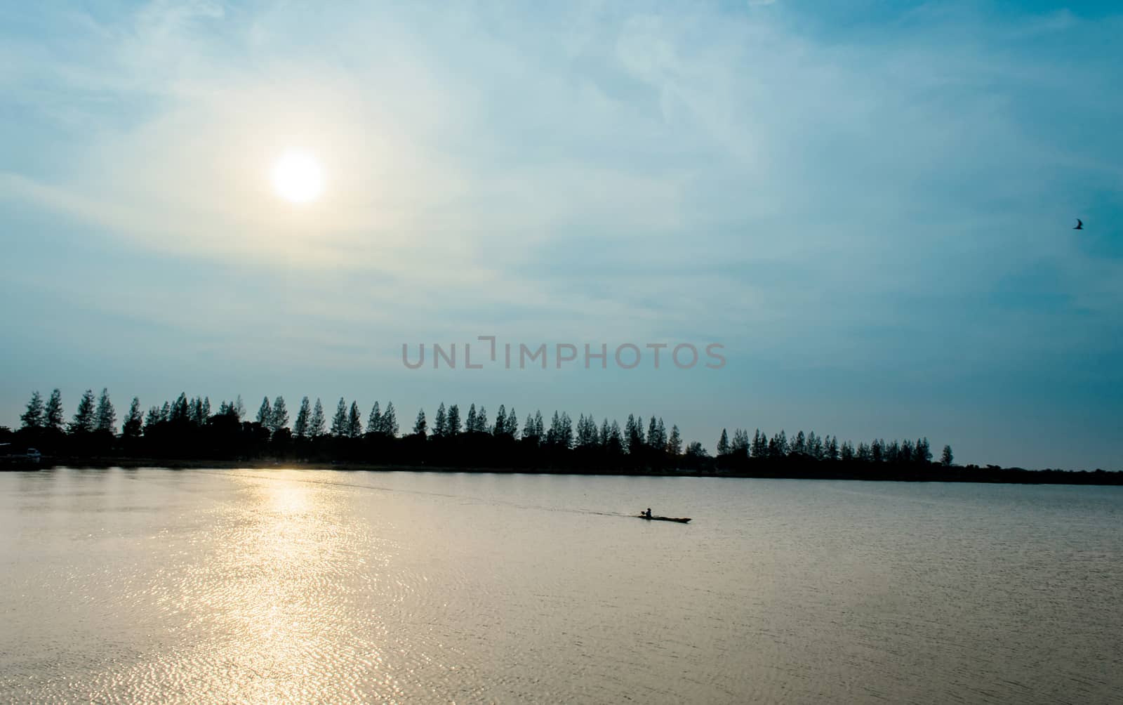 Fisherman Boat and Morning Sunrise on River in Thailand by kobfujar