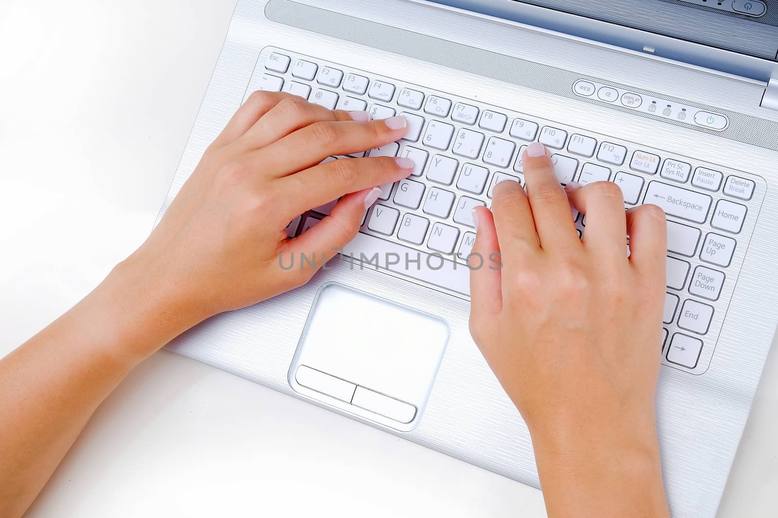 Keyboard Typing.female texting on a white laptop keyboard