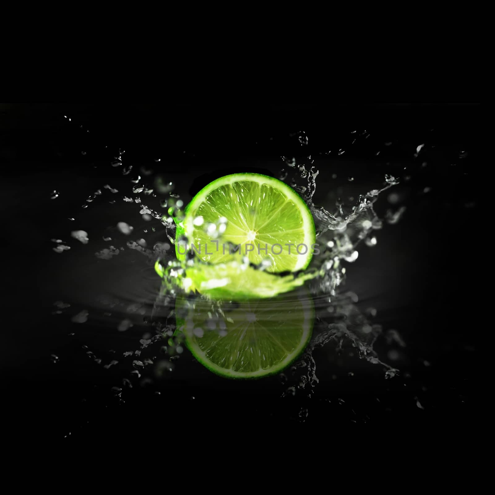 splashing cutted lime on a black background