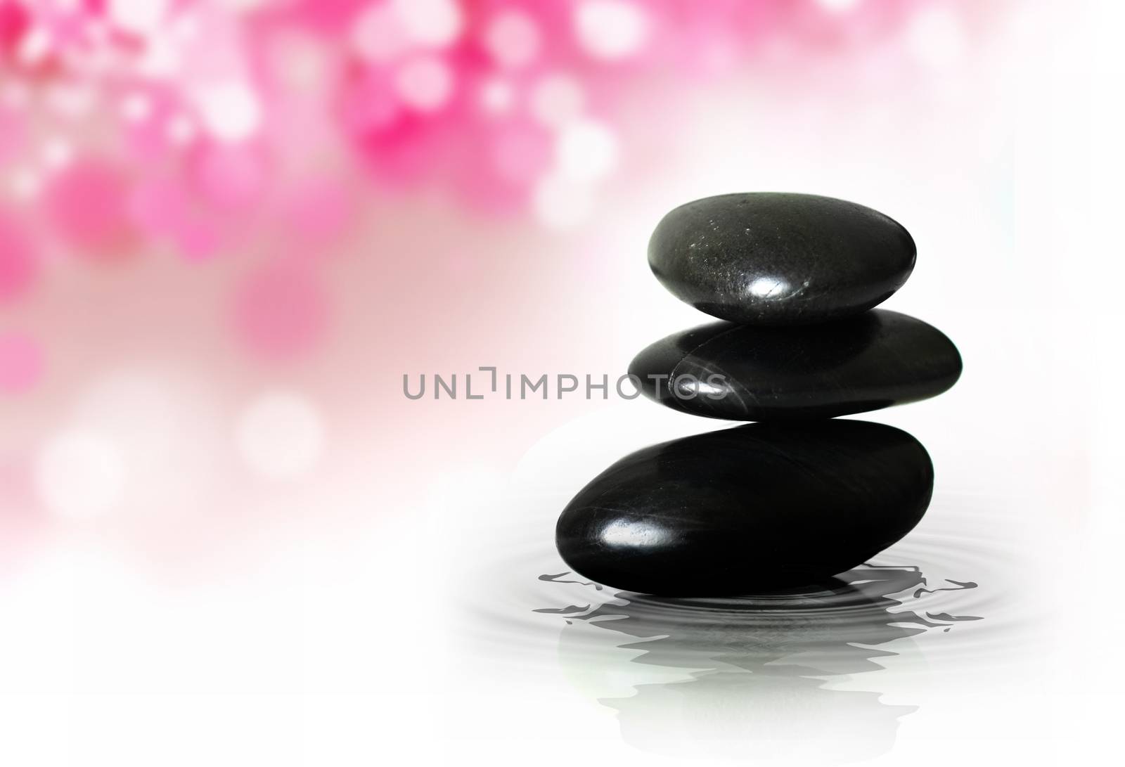 Spa Stones on a pink blured background