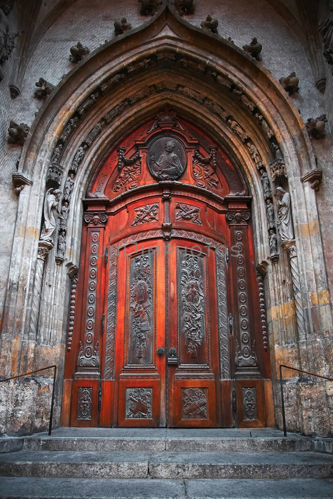Ancient cathedral wooden gothic door brown wood.