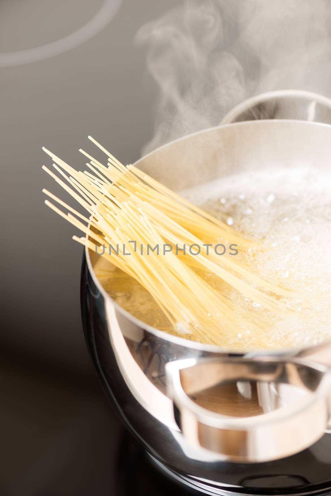 Pan with spaghetti close up by Nanisimova