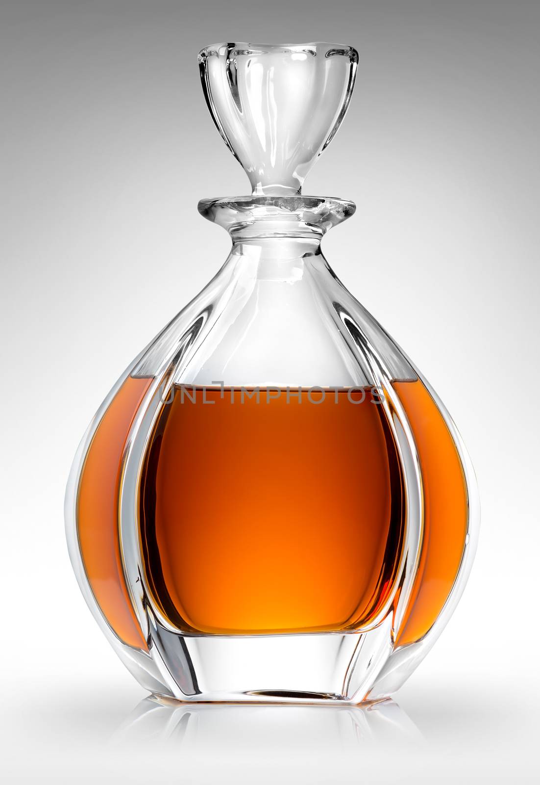 Carafe with whiskey on a gray background