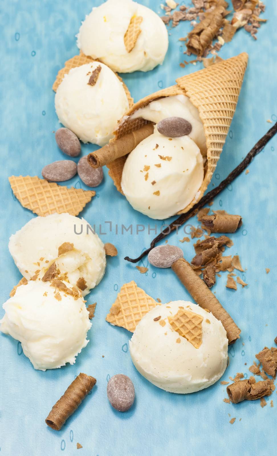 Vanilla Ice Cream, cone and cone pieces scattered. Macro photograph with shallow depth of field.