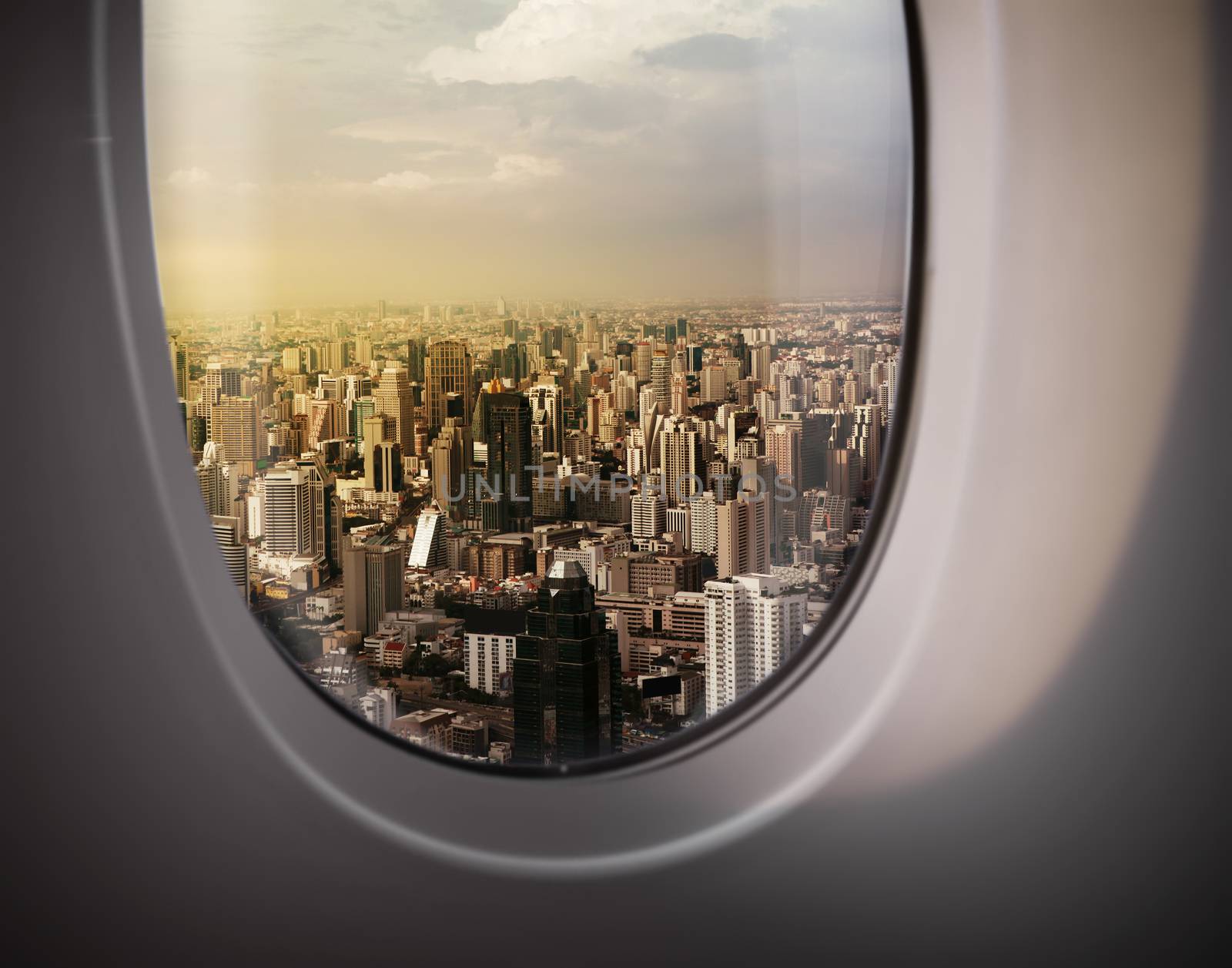 beautiful city view of Bangkok with blue sky from plane window