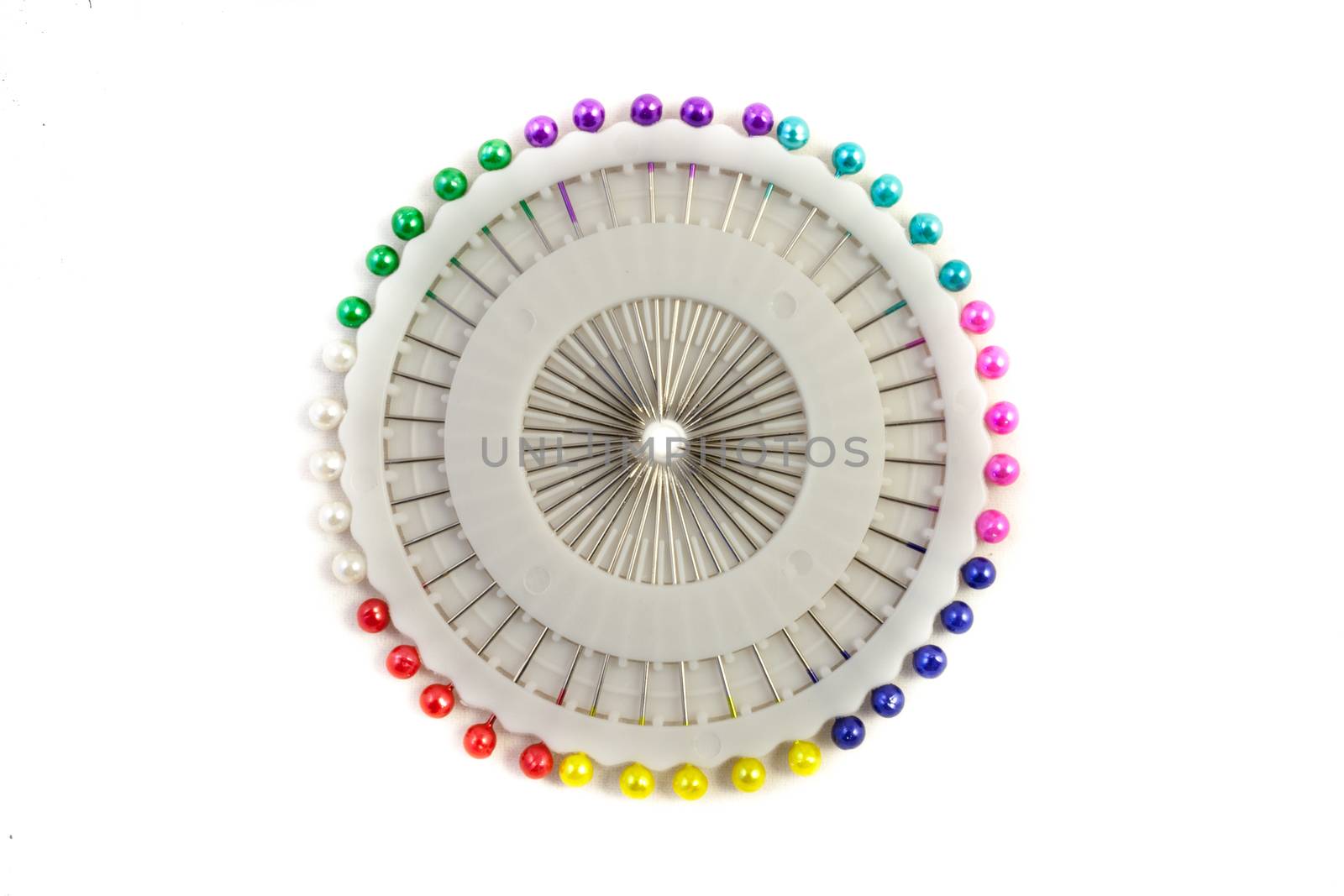 Sewing pin needles in their case on an isolated white background