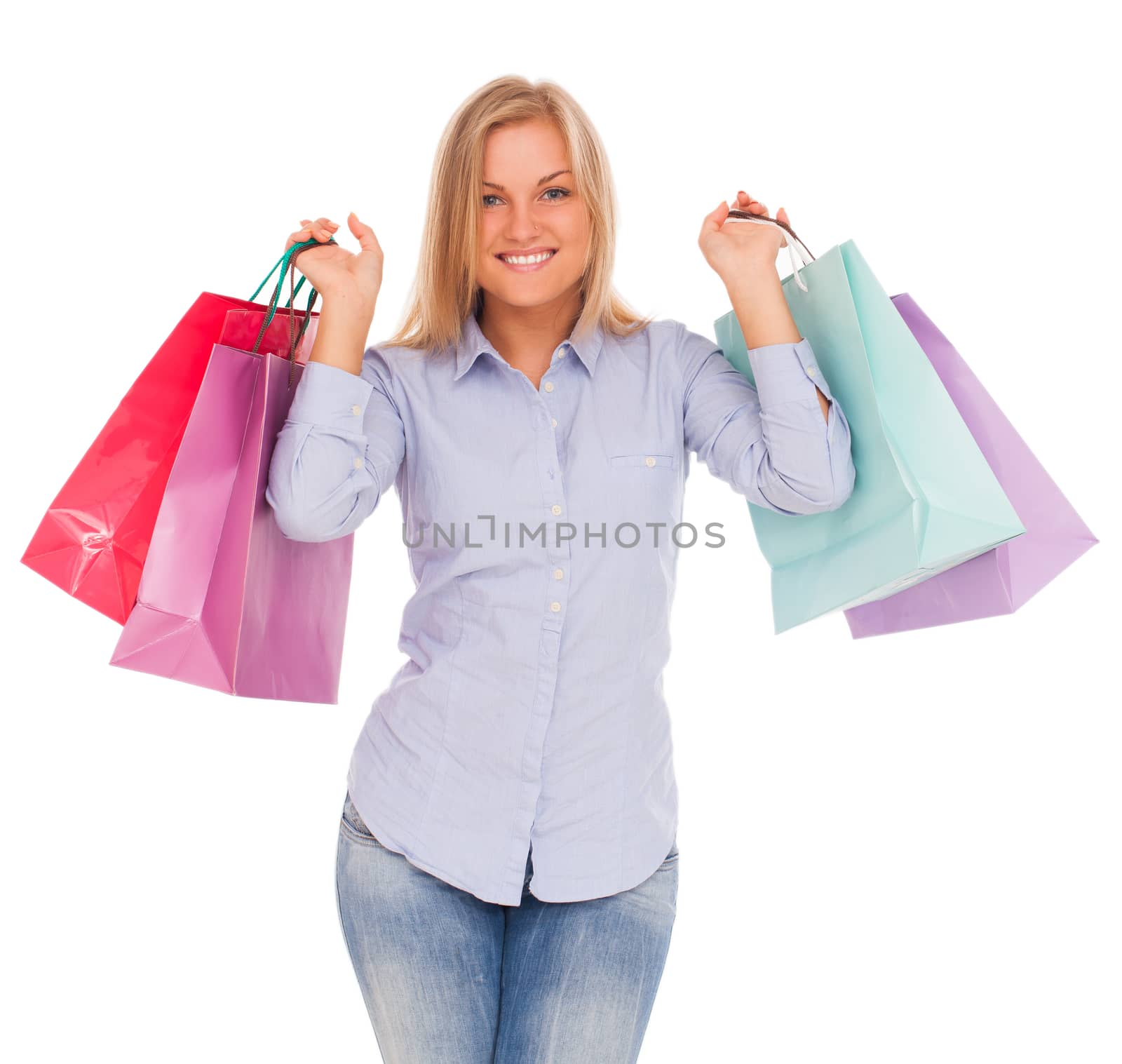 Young blond caucasian woman with shopping bags smiling over white background