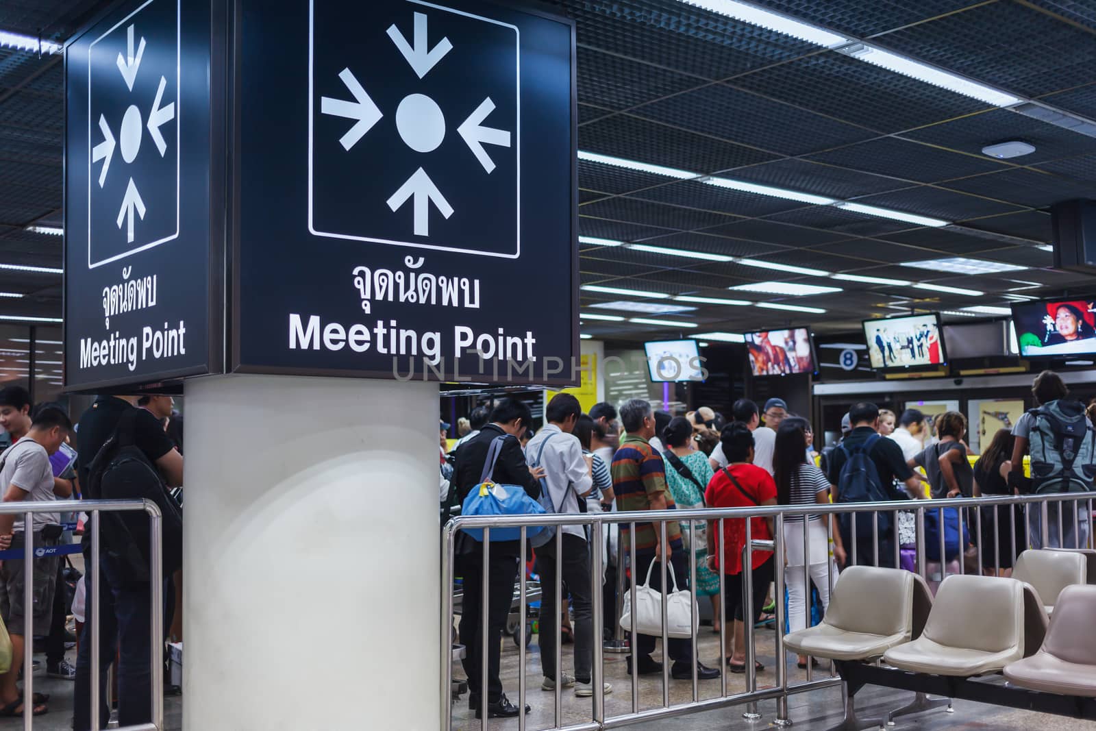 BANGKOK THAILAND - FEBRUARY 17 : The meeting point sign and business crowd or people waiting queue for transportation or taxi at Donmueang International Airport Bangkok, Thailand on February 17, 2015