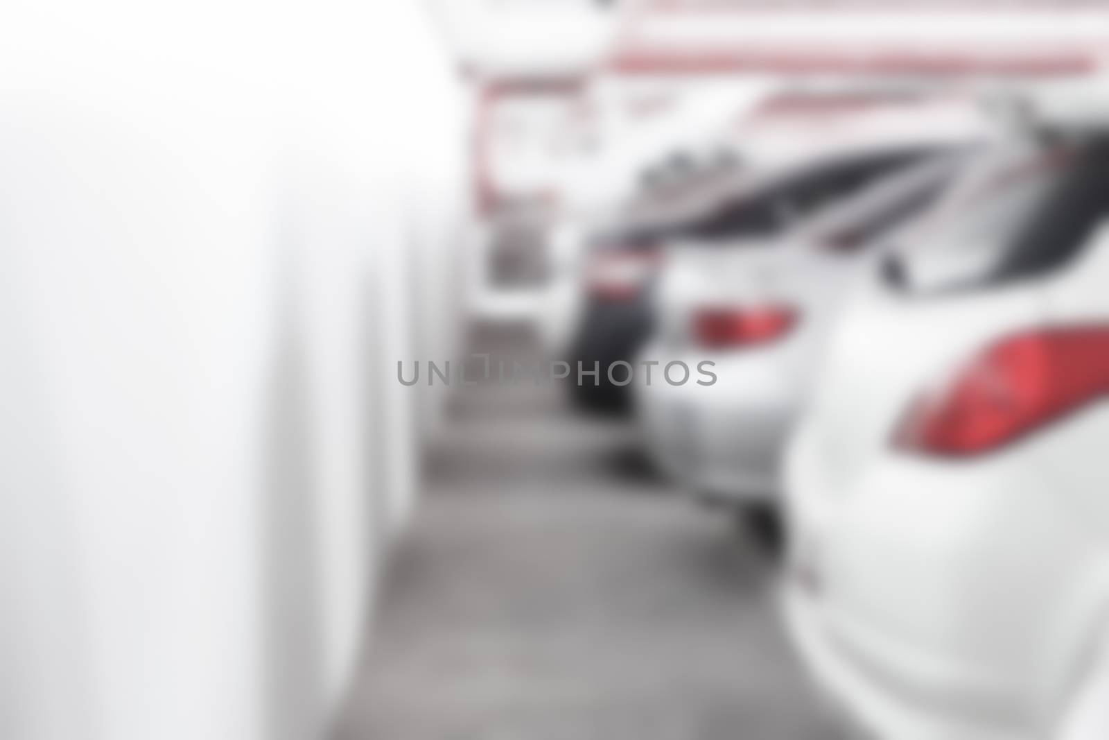 Abstract blur background of The back of car at the parking lot with wall space, shallow depth of focus